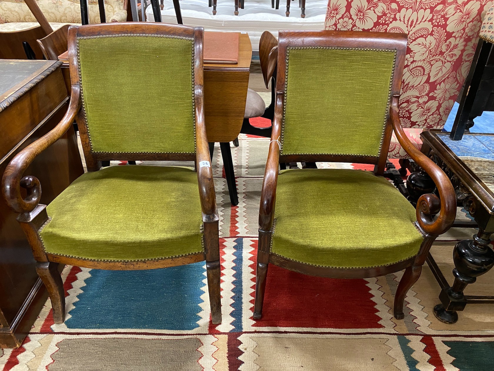 A near pair of 19th century French mahogany open armchairs, width 54cm, depth 54cm, height 92cm